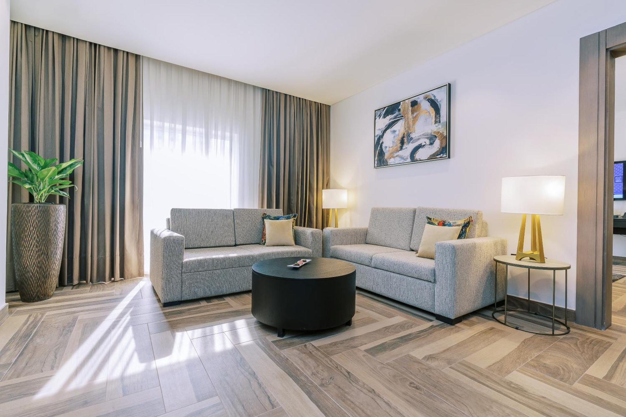 Khalidia Palace Hotel Dubai By Mourouj Gloria Екстериор снимка A living room at the hotel