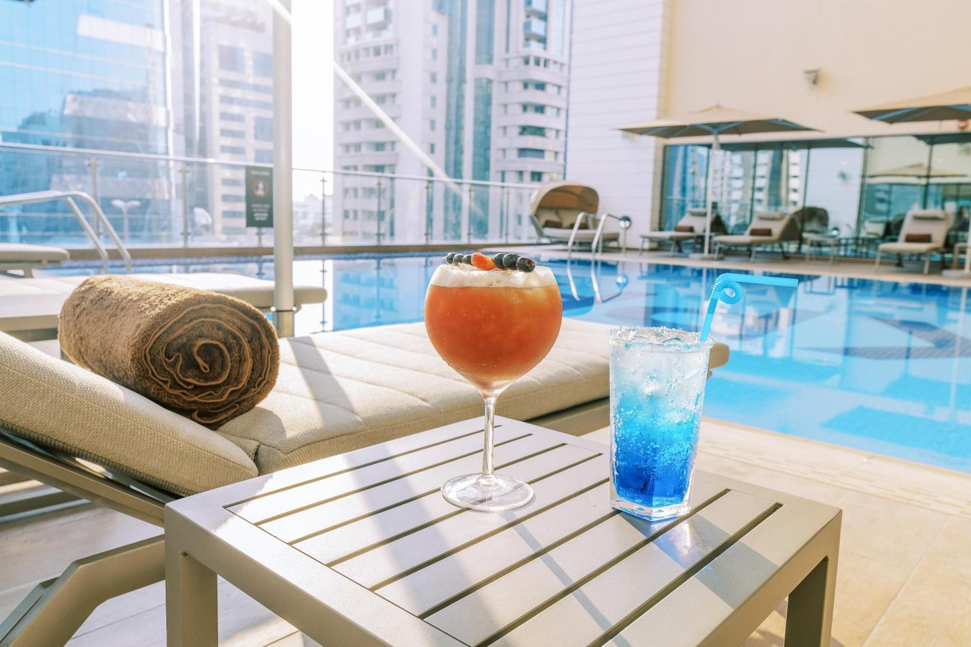 Khalidia Palace Hotel Dubai By Mourouj Gloria Екстериор снимка The pool at the hotel
